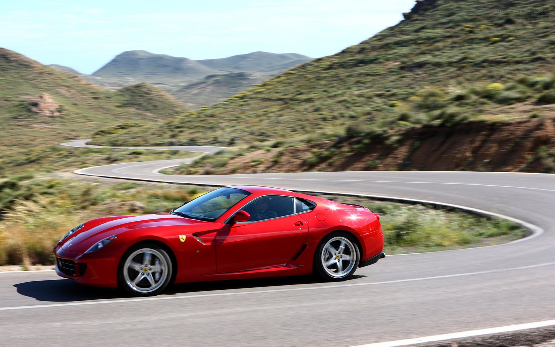 Red Ferrari on winding road