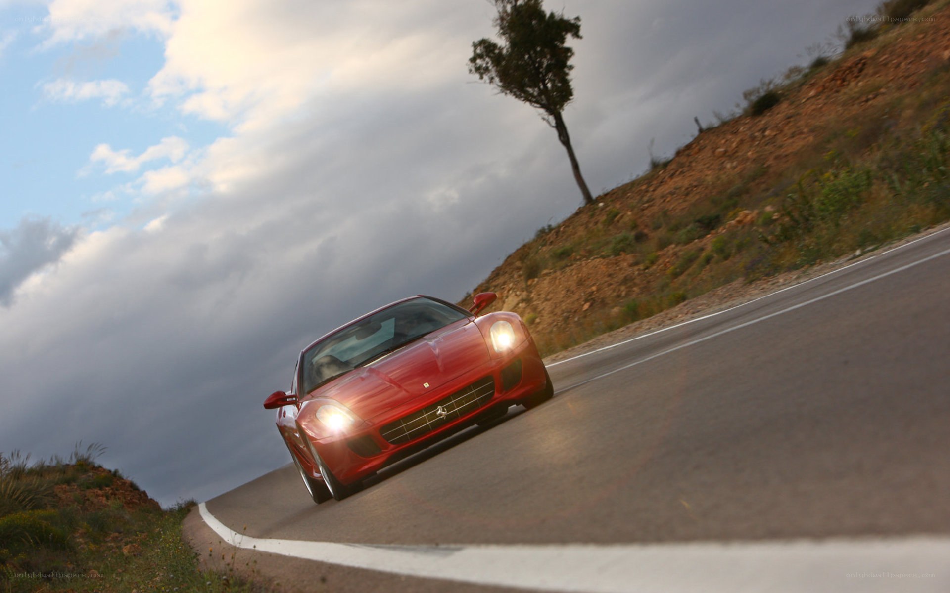 Red Ferrari on winding road