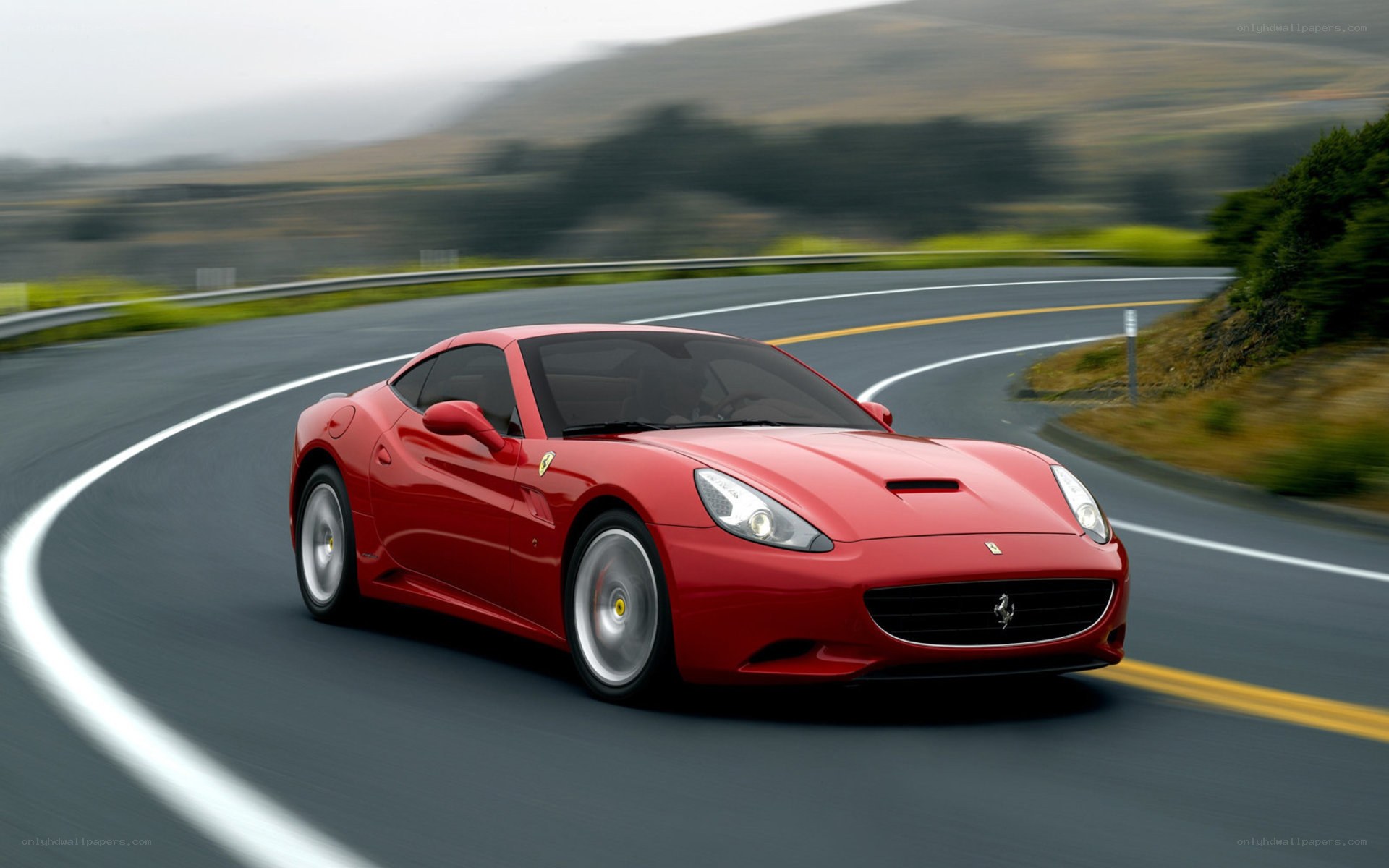 Red Ferrari on winding road