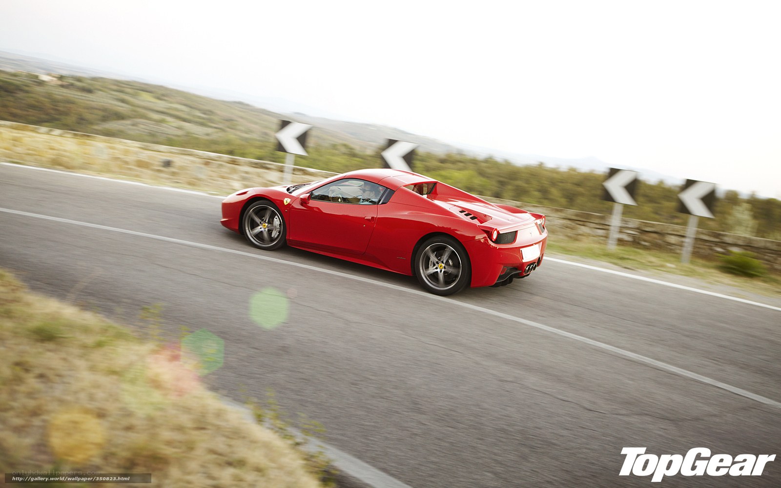 Red Ferrari on winding road