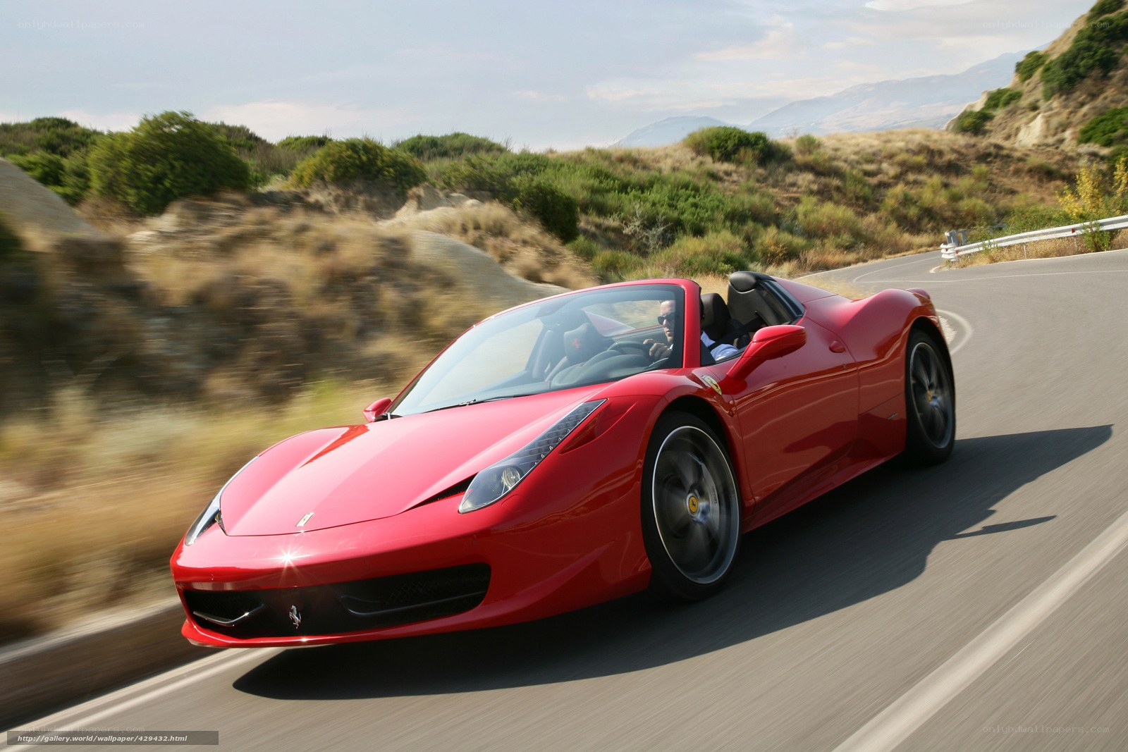Red Ferrari on winding road