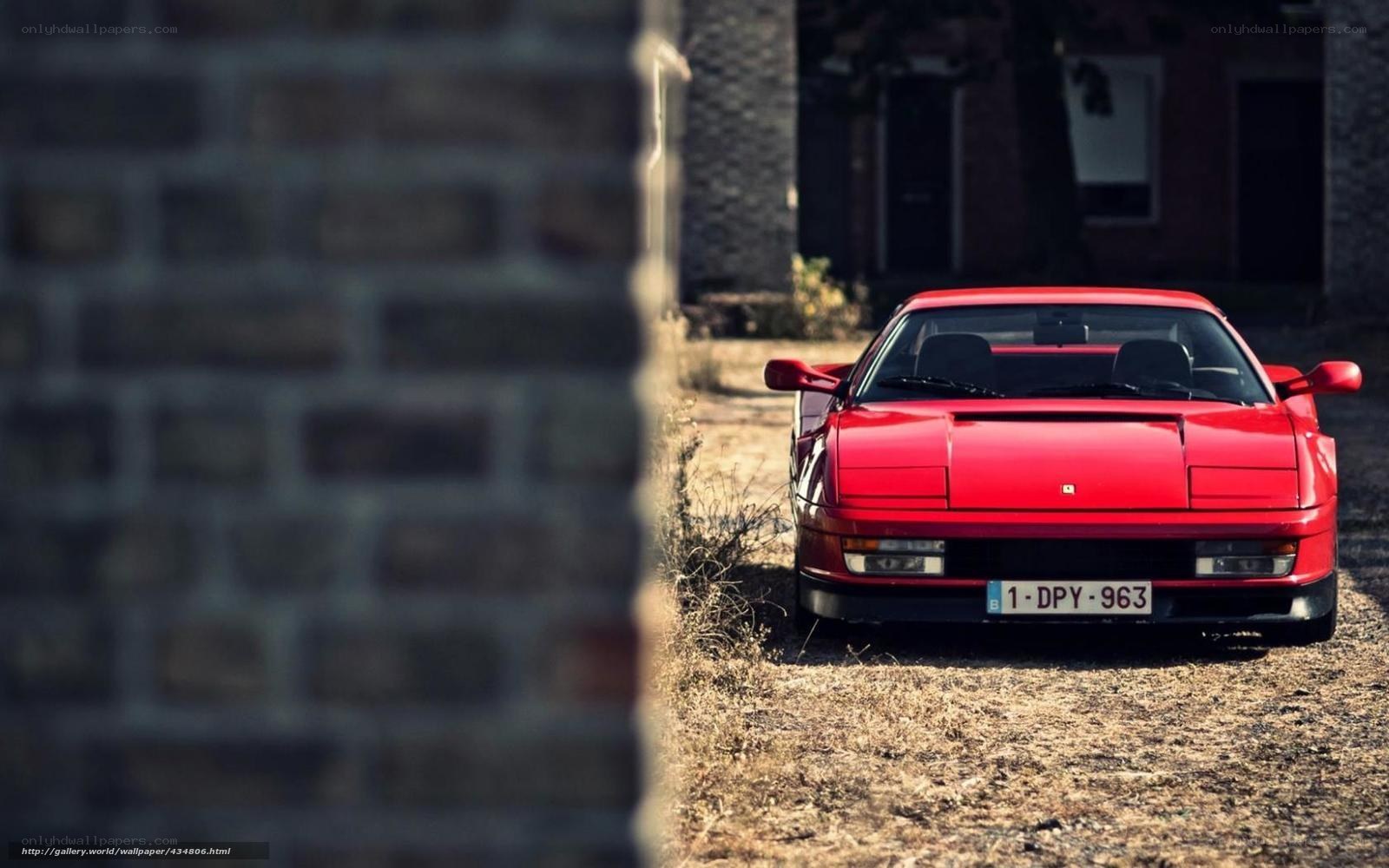 Red Ferrari parked in alley
