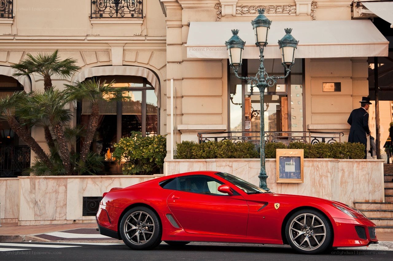 Red Ferrari parked in Monaco