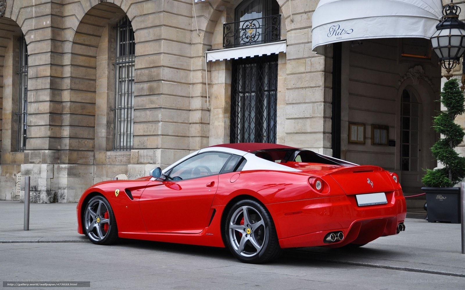 Red Ferrari parked in Paris