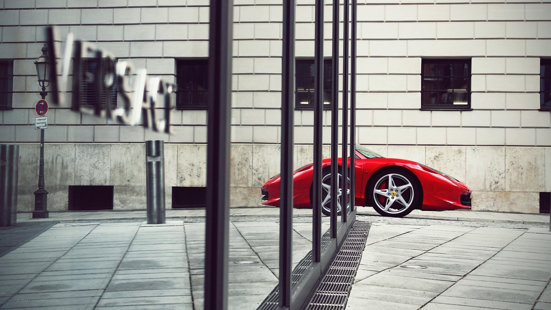 Red Ferrari parked on street
