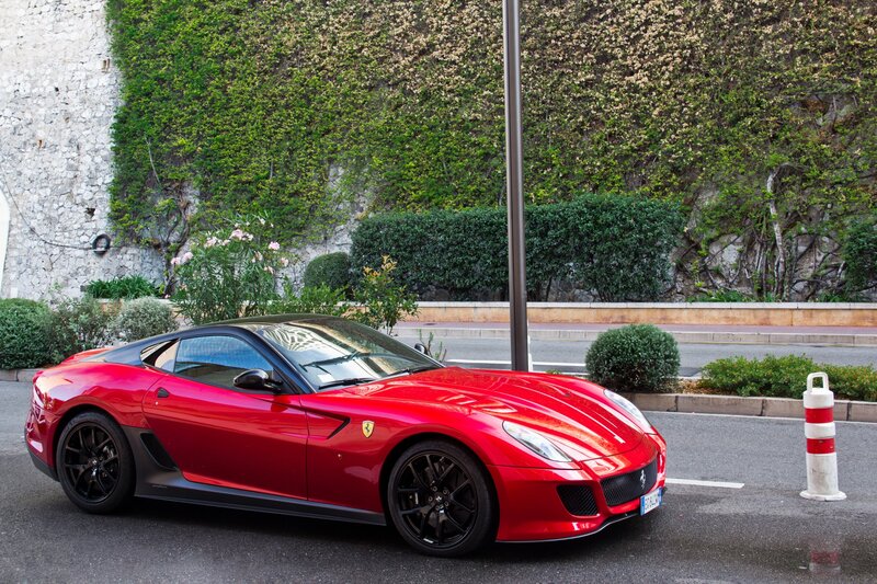 Red Ferrari parked on street