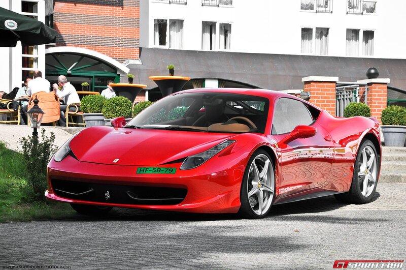 Red Ferrari parked outside
