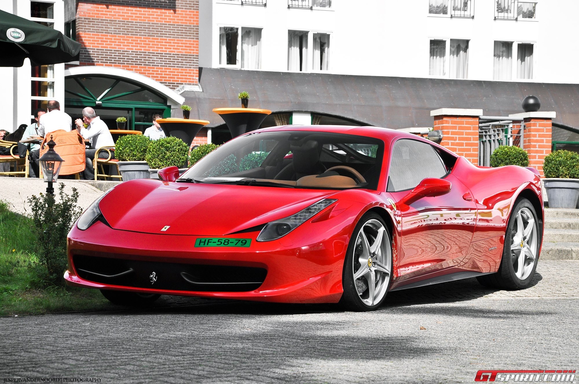 Red Ferrari parked outside