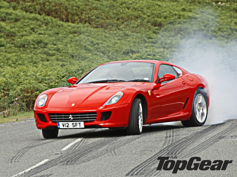 Red Ferrari performing burnout