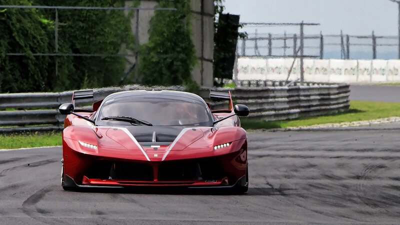 Red Ferrari Race Car — Dynamic, Afternoon, Photograph, Race Track