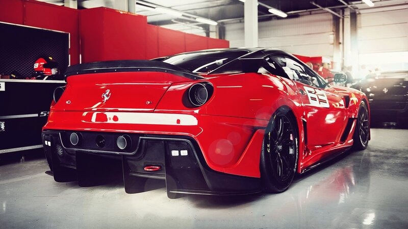 Red Ferrari race car in garage