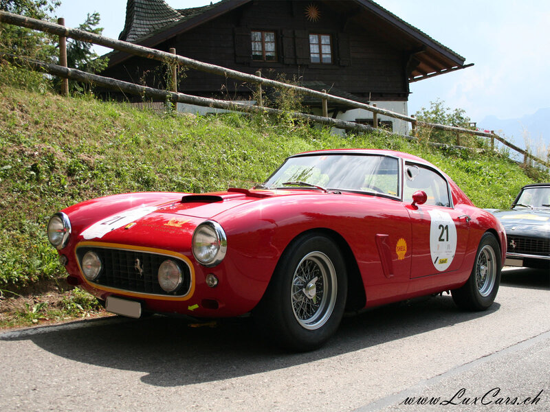 Red Ferrari race car on road