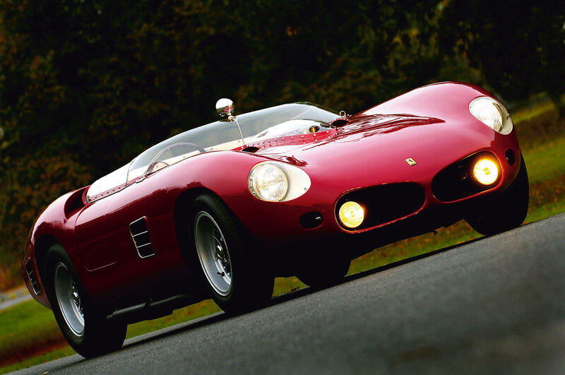 Red Ferrari race car on road