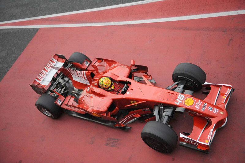 Red Ferrari race car on track