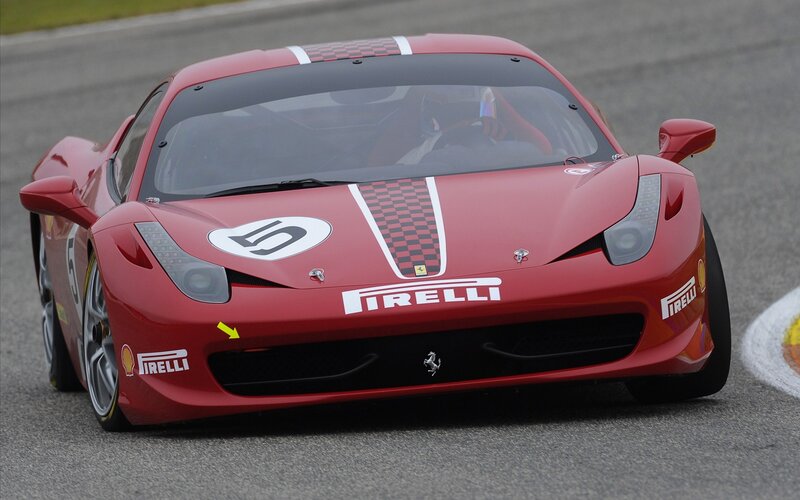 Red Ferrari race car on track