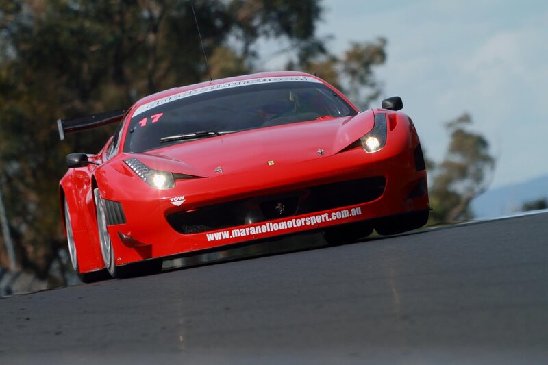 Red Ferrari race car on track