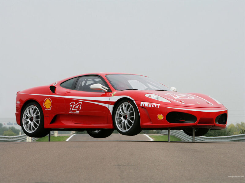 Red Ferrari race car on track