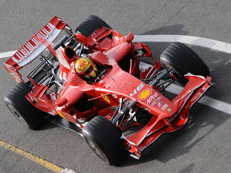 Red Ferrari race car on track