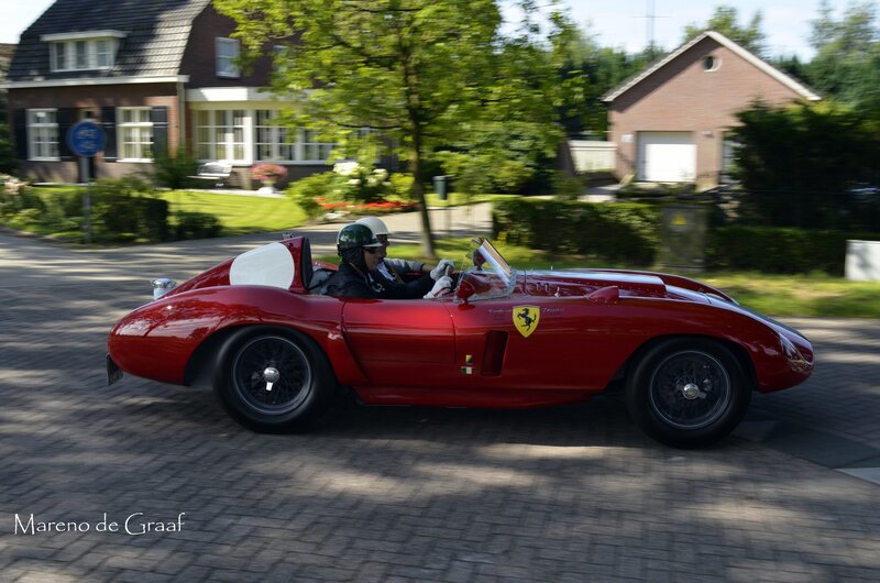 Red Ferrari racing car on street