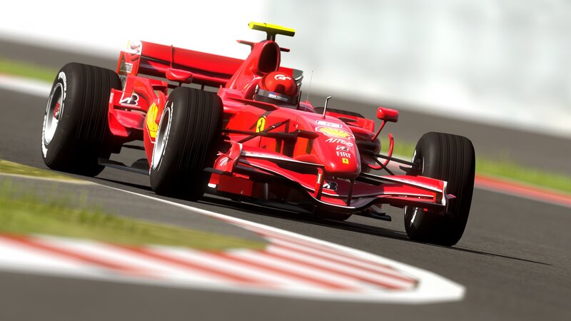 Red Ferrari racing car on track