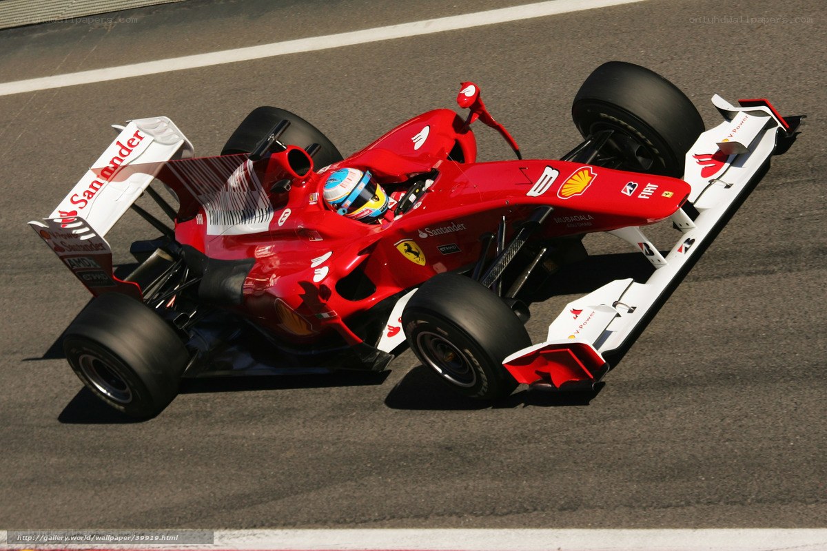 Red Ferrari racing car on track