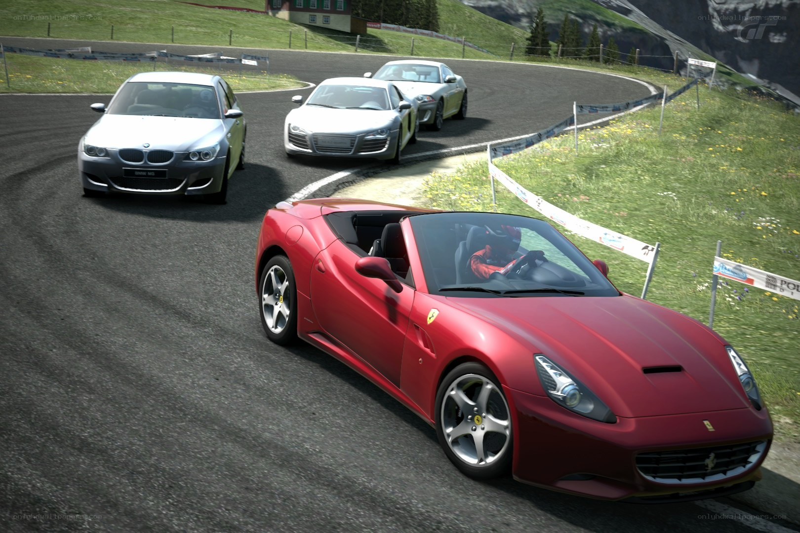 Red Ferrari racing on a track