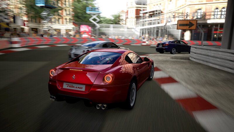 Red Ferrari racing on city track