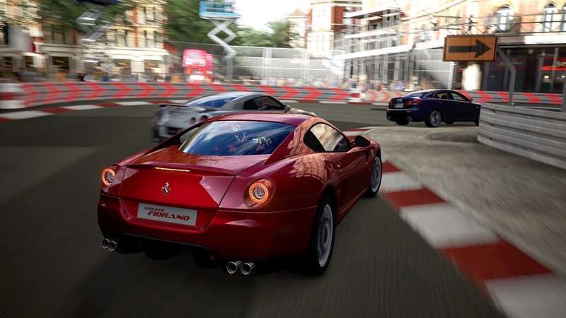 Red Ferrari racing on track