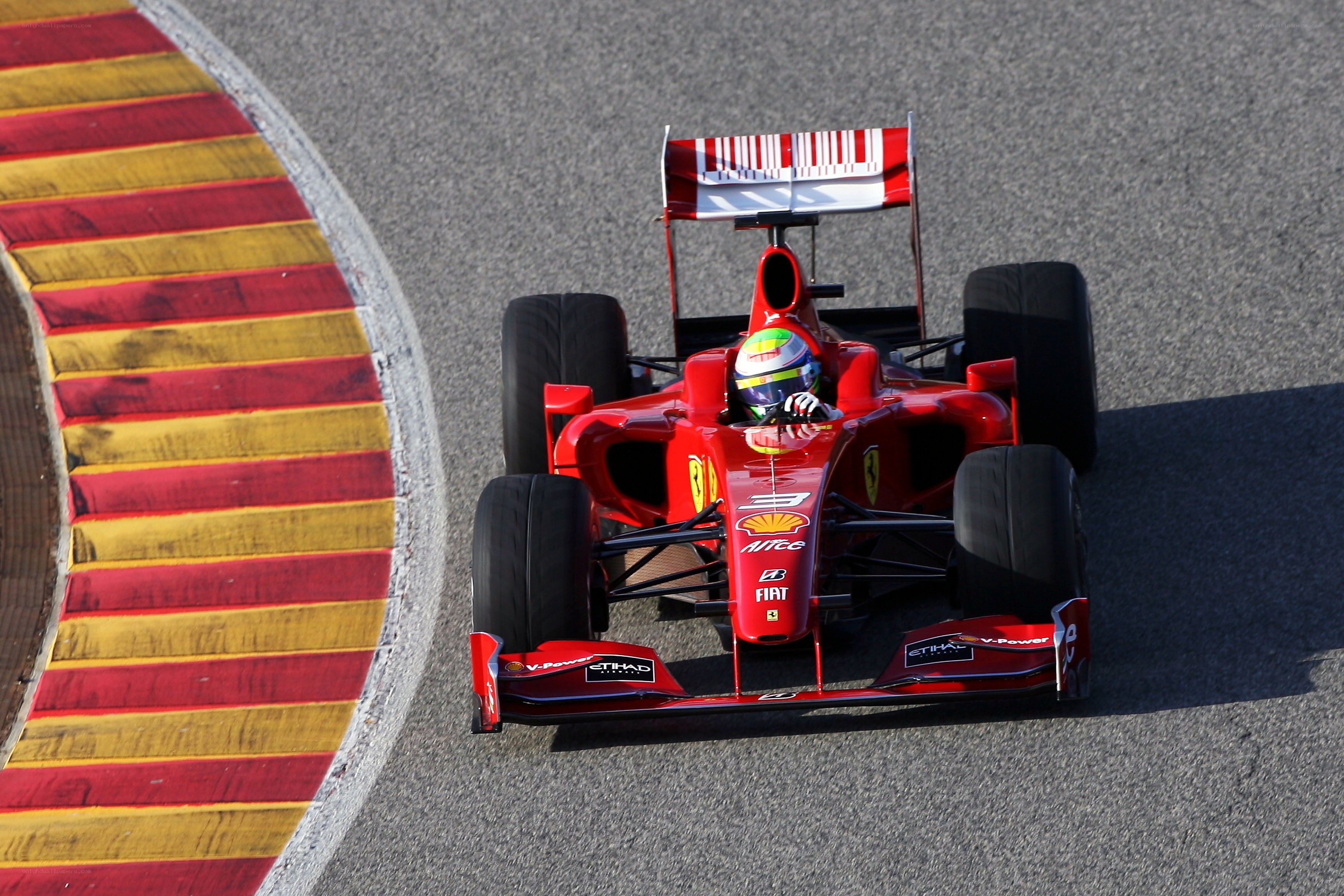 Red Ferrari racing on track