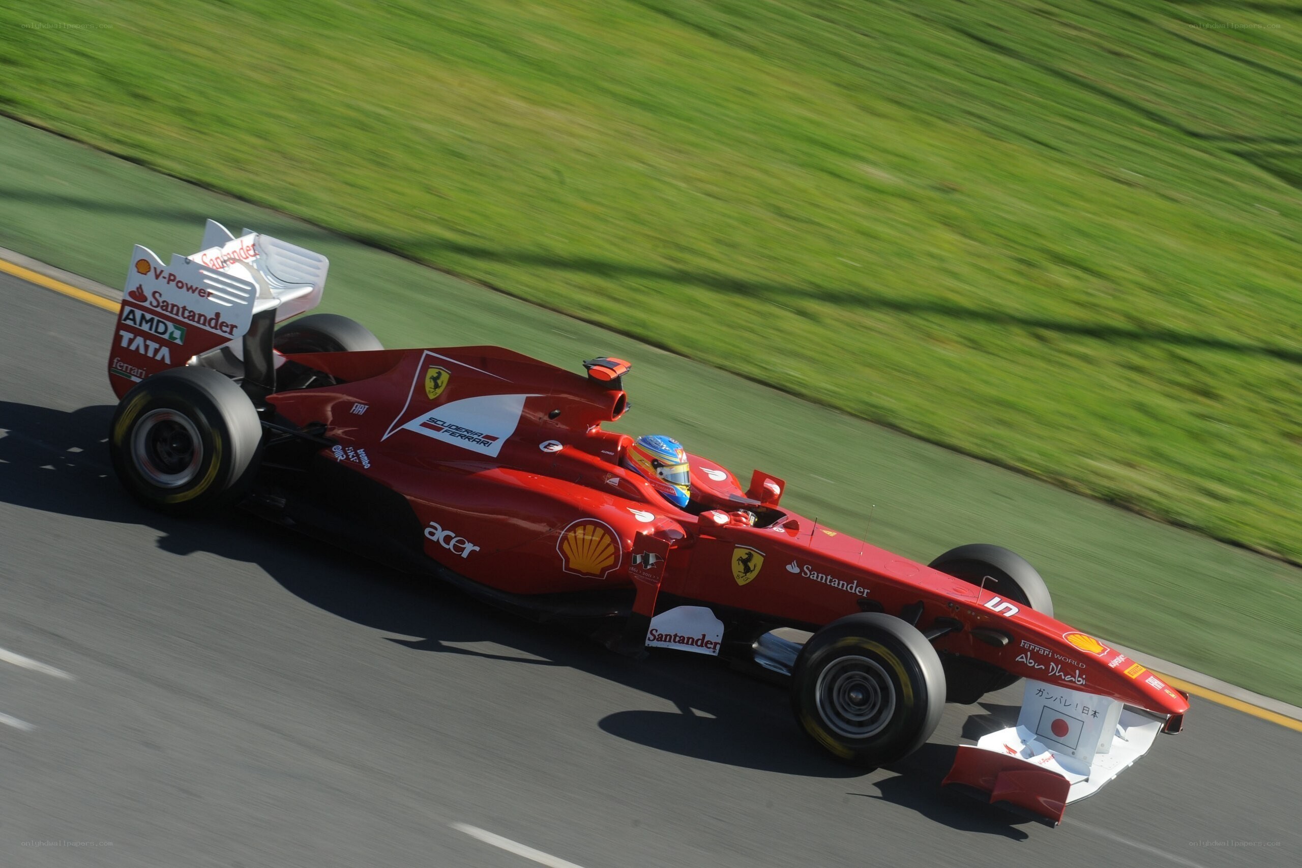 Red Ferrari racing on track