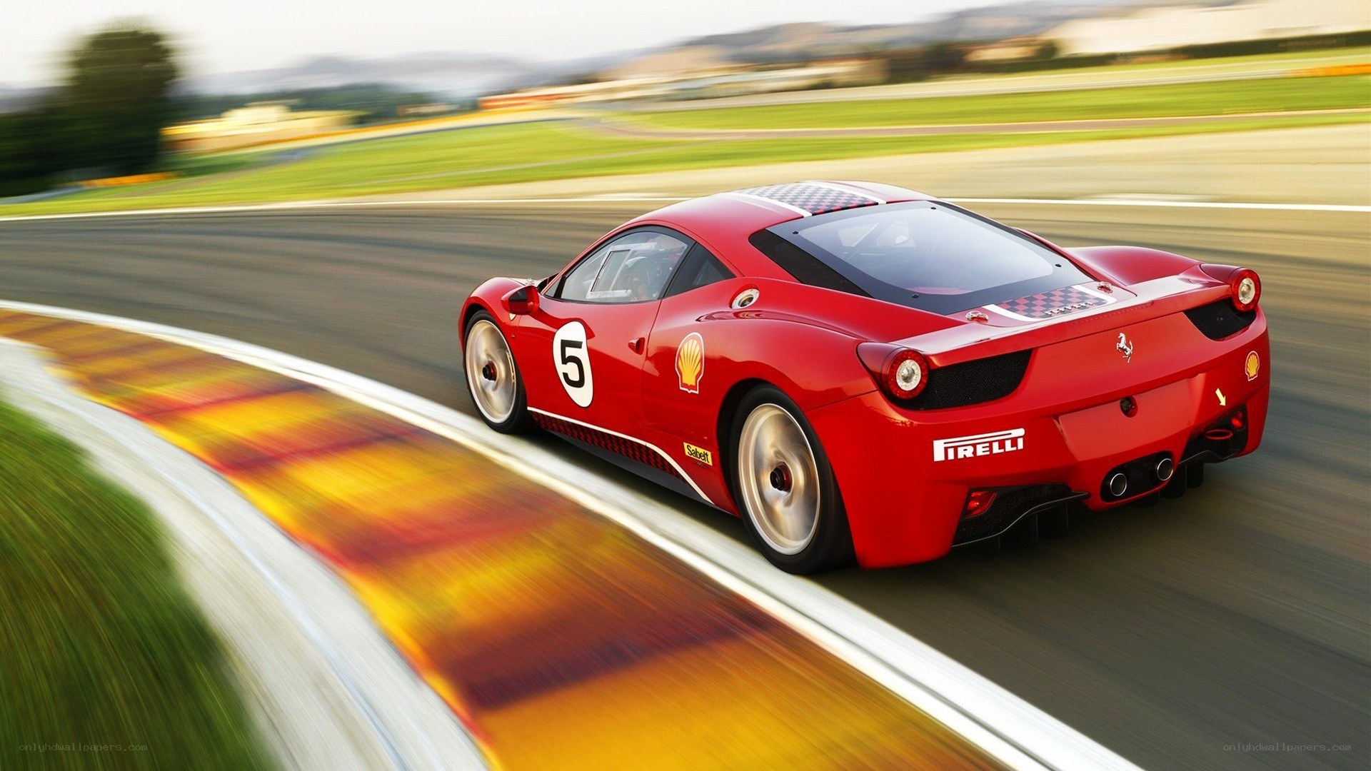 Red Ferrari racing on track