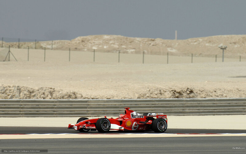 Red Ferrari racing on track