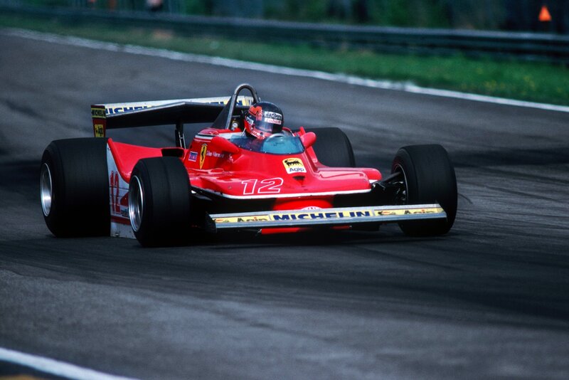 Red Ferrari racing on track