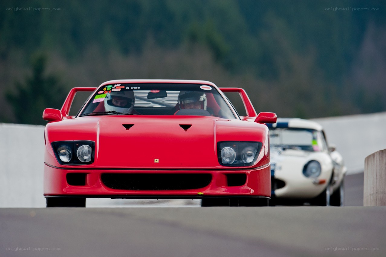Red Ferrari racing on track