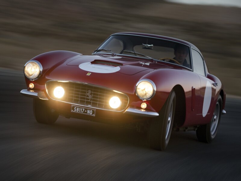 Red Ferrari racing on track