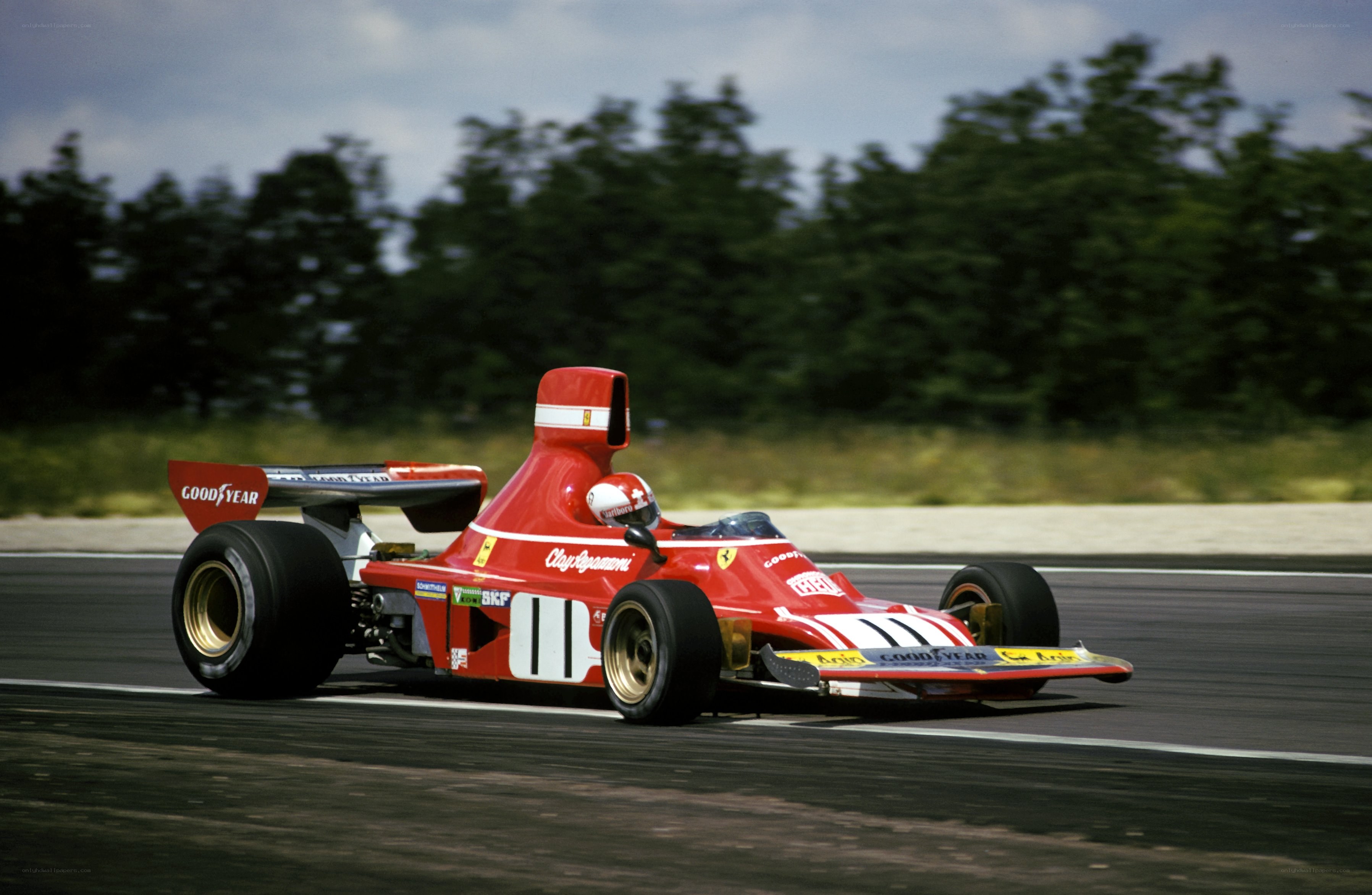 Red Ferrari racing on track
