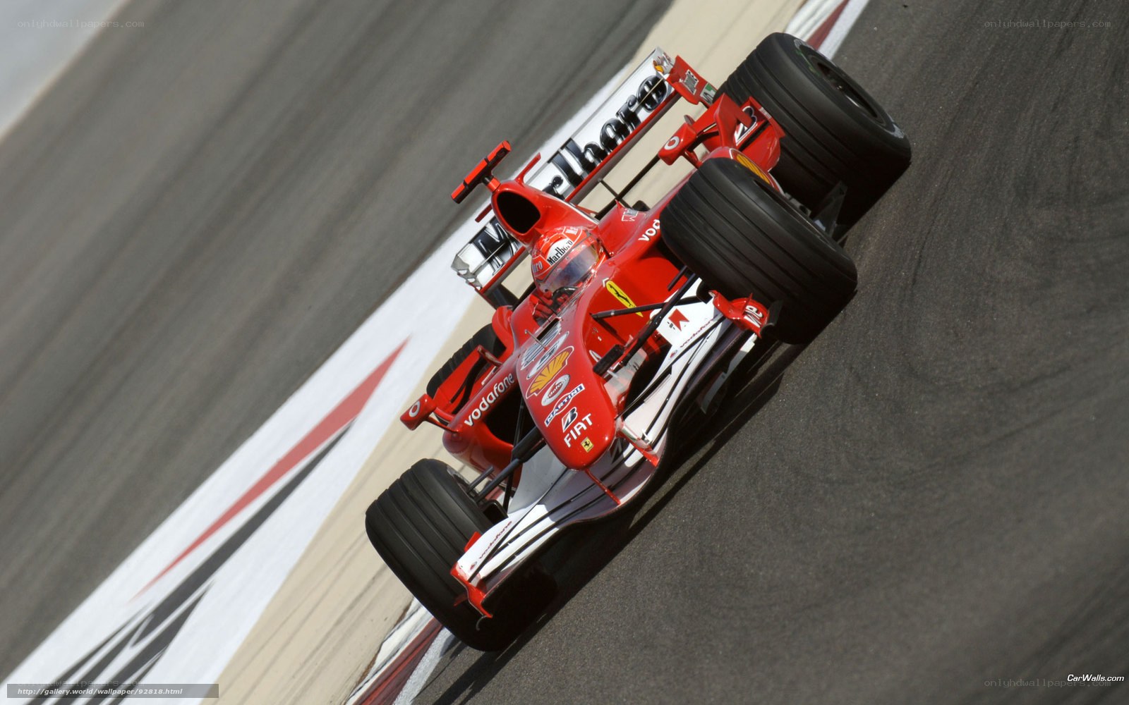 Red Ferrari racing on track