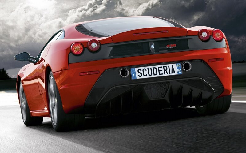 Red Ferrari Scuderia in motion