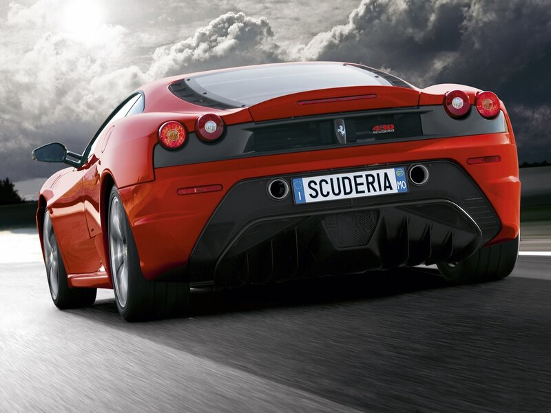 Red Ferrari Scuderia in motion