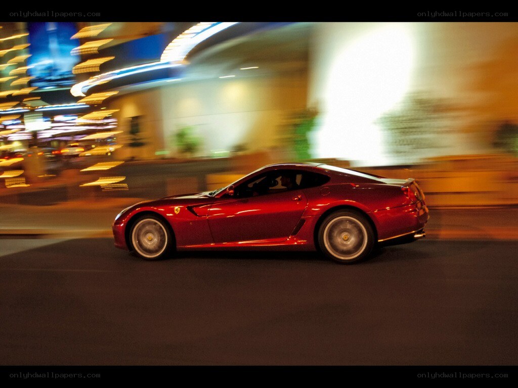 Red Ferrari speeding at night