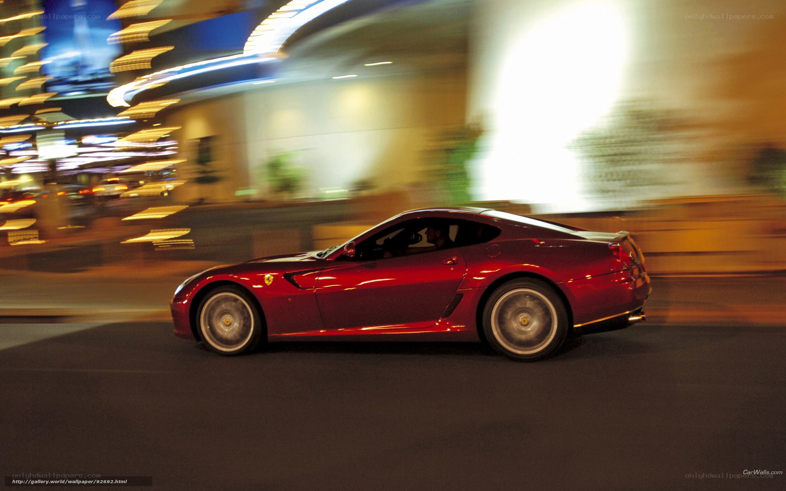 Red Ferrari sports car at night