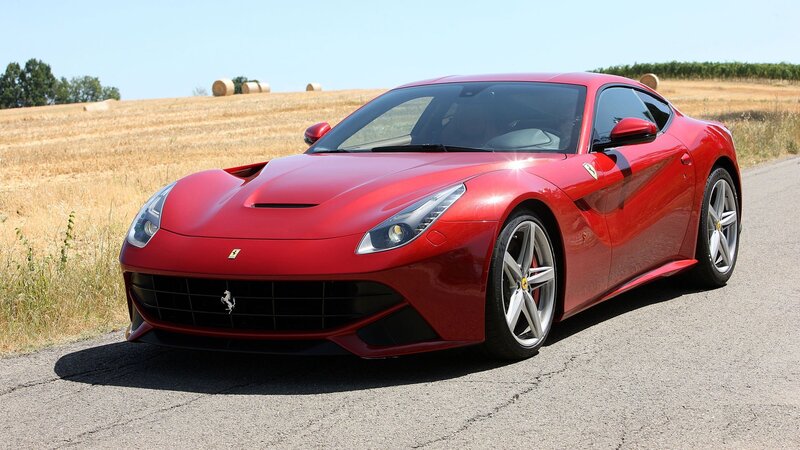 Red Ferrari Sports Car — Calm, Afternoon, Photograph, Field