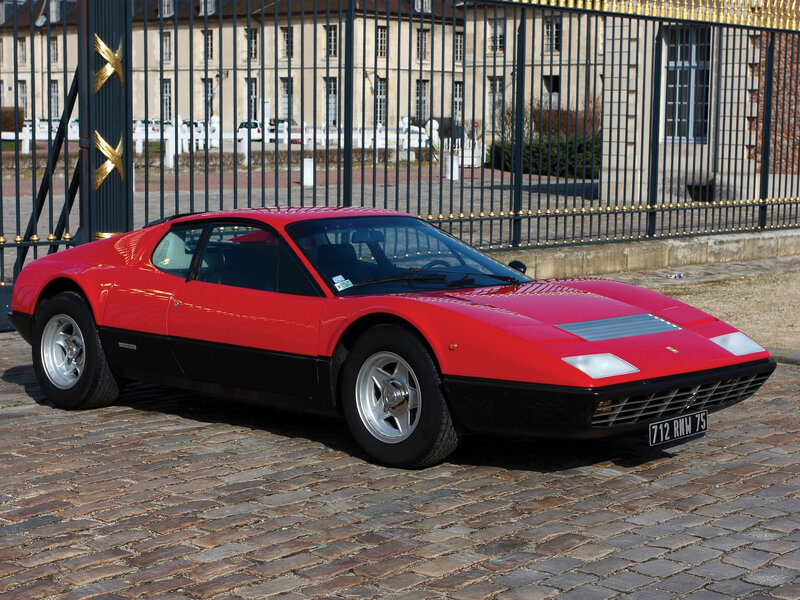 Red Ferrari Sports Car — Calm, Afternoon, Photograph, Gate
