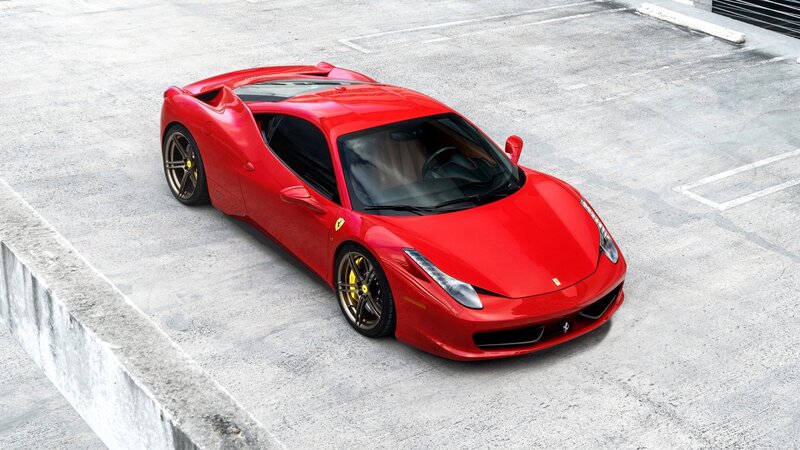 Red Ferrari Sports Car — Calm, Photograph, Concrete Surface