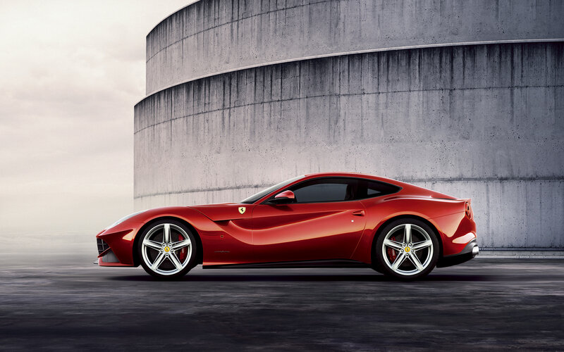 Red Ferrari Sports Car — Dramatic, Photograph, Concrete Structure, Car Wheel