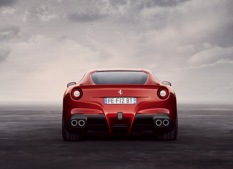 Red Ferrari Sports Car — Dramatic, Photograph, License Plate, Exhaust Pipes, Cloudy Sky, Black, Gray