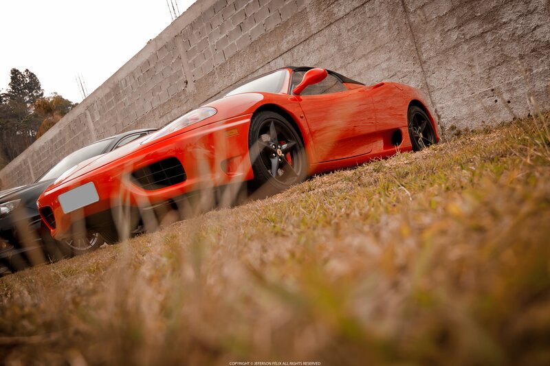Red Ferrari Sports Car — Dramatic, Photograph, Wall, Grass