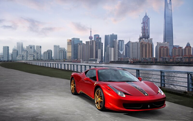Red Ferrari Sports Car — Dramatic, Sunset, Photograph, City Skyline, River