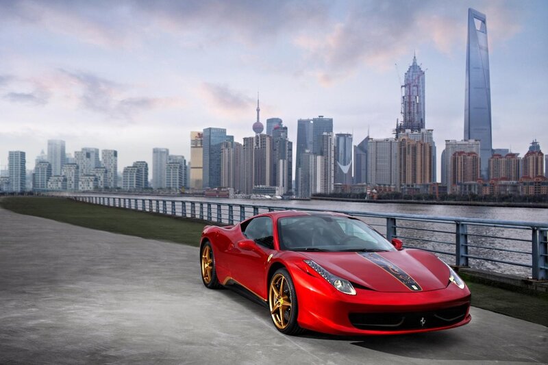 Red Ferrari Sports Car — Dramatic, Sunset, Photograph, Skyscraper, River, Cityscape