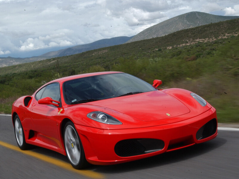Red Ferrari Sports Car — Dynamic, Afternoon, Photograph, Mountain